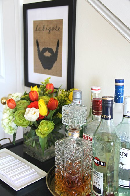vintage bar cart styled with flowers and bottles